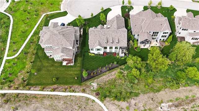 birds eye view of property with a residential view