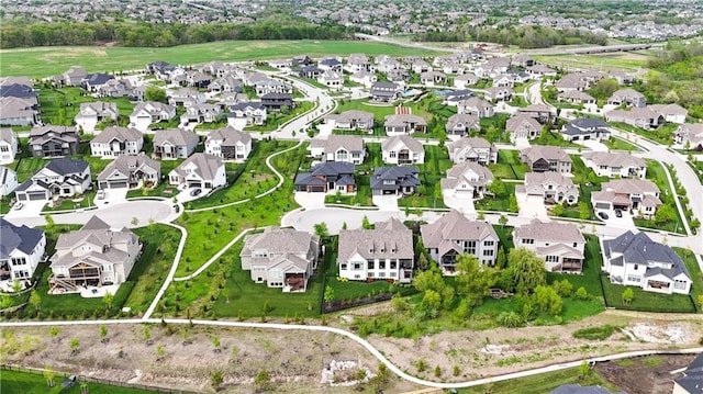 birds eye view of property with a residential view
