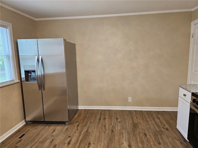 kitchen with stainless steel fridge with ice dispenser, white cabinets, baseboards, and wood finished floors