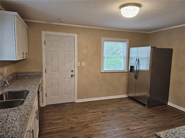 kitchen with light stone countertops, a sink, dark wood finished floors, white cabinetry, and stainless steel refrigerator with ice dispenser