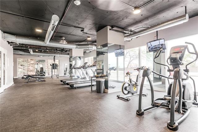 gym featuring baseboards