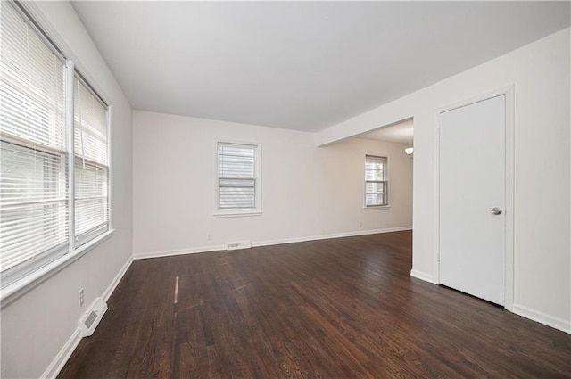 3525-3527 Bell St, Kansas City, MO 64111 - empty room featuring visible vents, wood finished floors, and baseboards