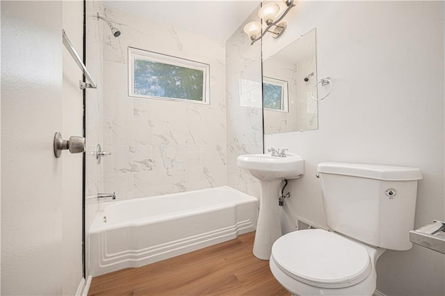3525-3527 Bell St, Kansas City, MO 64111 - full bathroom featuring toilet, shower / bath combination, a healthy amount of sunlight, and wood finished floors