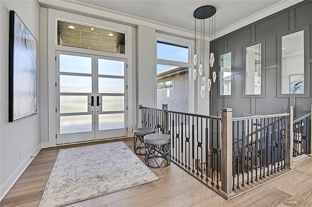 12605 W 170th St, Overland Park, KS 66221 - sitting room featuring an upstairs landing, wood finished floors, baseboards, ornamental molding, and french doors