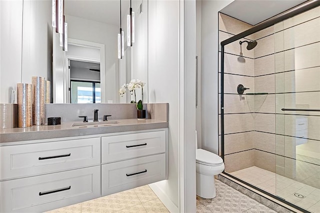 12605 W 170th St, Overland Park, KS 66221 - bathroom with a tile shower, vanity, toilet, and tile patterned floors