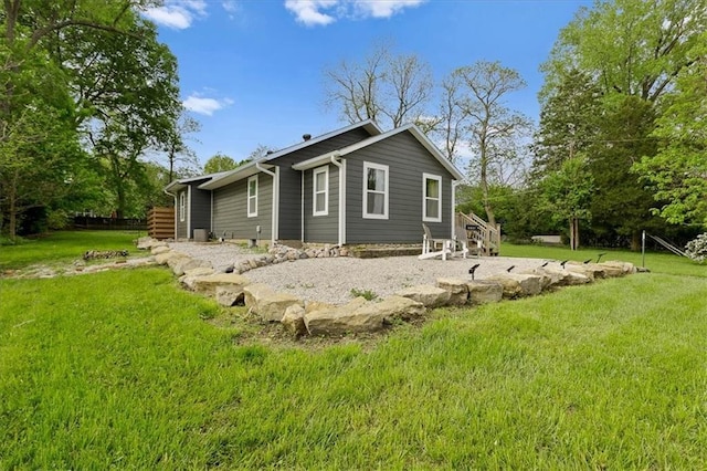 back of house with a yard