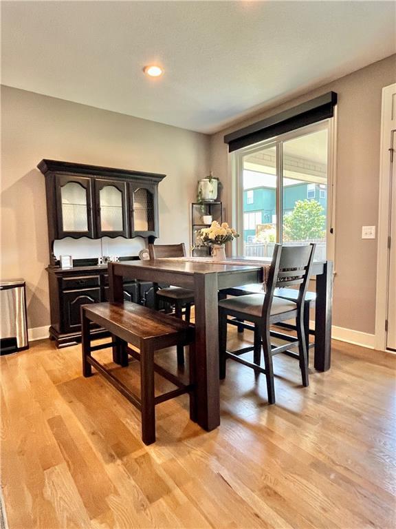 dining area featuring baseboards, recessed lighting, and light wood-style flooring