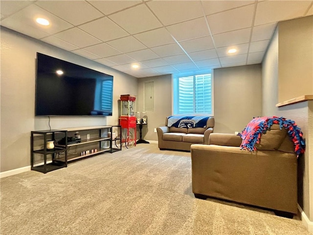 carpeted living room with baseboards, recessed lighting, and a drop ceiling