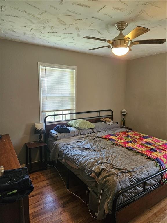 8212 NE 51st St, Kansas City, MO 64119 - bedroom featuring a ceiling fan and wood finished floors