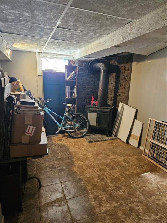 8212 NE 51st St, Kansas City, MO 64119 - below grade area with a wood stove