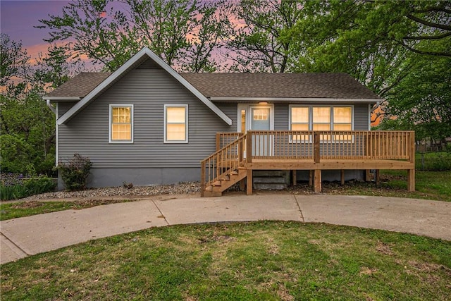 321 22nd Street Ter, Blue Springs, MO 64015 - view of front of home with a lawn and a porch