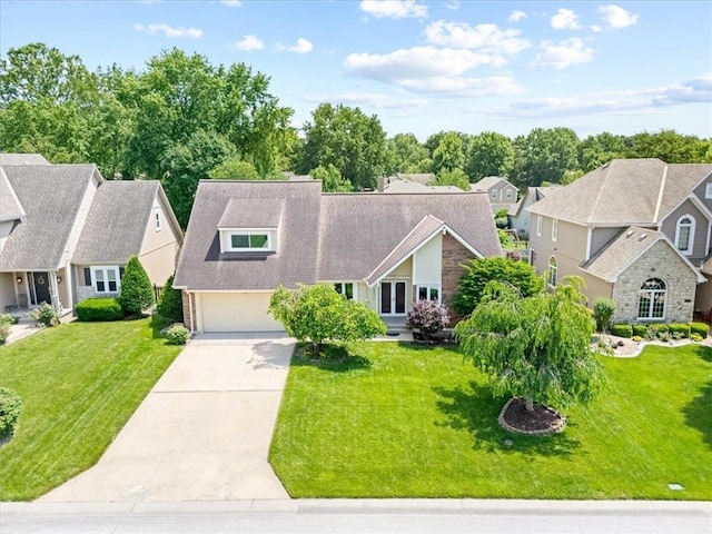 4071 SW Royale Ct, Lees Summit, MO 64082 - view of front of property featuring driveway, a residential view, a front yard, and an attached garage