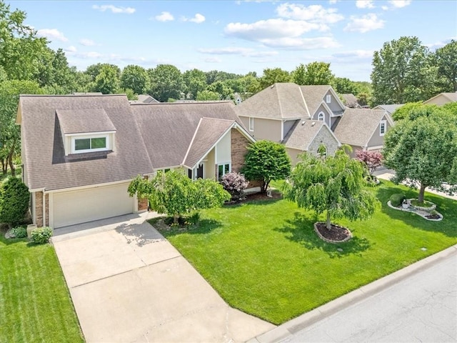 4071 SW Royale Ct, Lees Summit, MO 64082 - view of front of property featuring an attached garage, driveway, a front yard, and roof with shingles