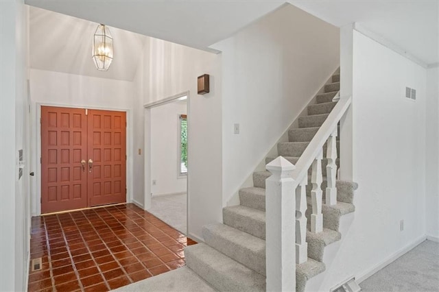 4071 SW Royale Ct, Lees Summit, MO 64082 - foyer entrance featuring stairs and a chandelier