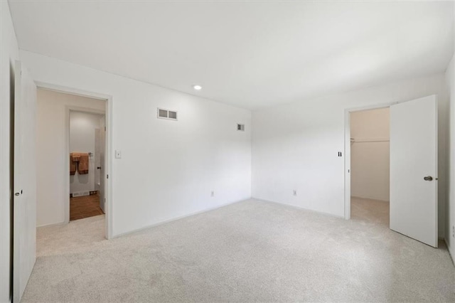 4071 SW Royale Ct, Lees Summit, MO 64082 - unfurnished bedroom with light colored carpet, a closet, a spacious closet, and recessed lighting