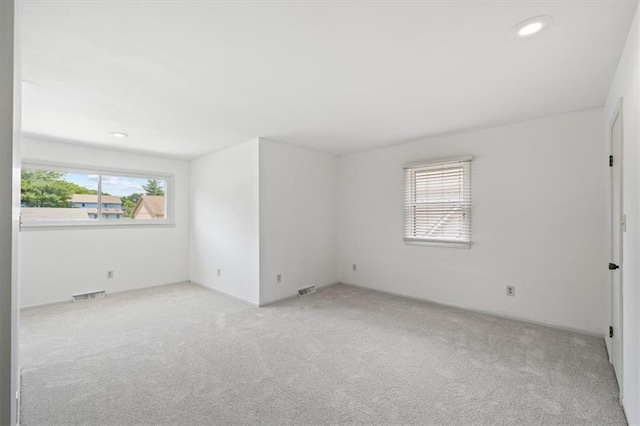4071 SW Royale Ct, Lees Summit, MO 64082 - spare room featuring light carpet and recessed lighting