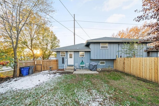 back of house featuring fence