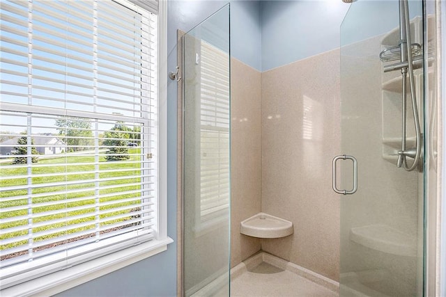 full bathroom with plenty of natural light and a stall shower