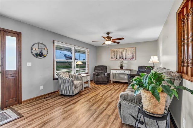 19890 State Highway C, Pattonsburg, MO 64670 - living room with light wood-style floors, a ceiling fan, and baseboards
