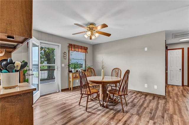 19890 State Highway C, Pattonsburg, MO 64670 - dining room featuring wood finished floors, a ceiling fan, and baseboards