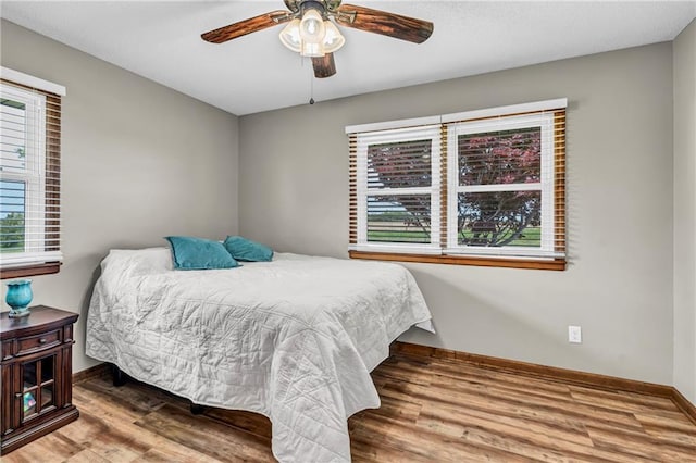 19890 State Highway C, Pattonsburg, MO 64670 - bedroom with baseboards, wood finished floors, and ceiling fan