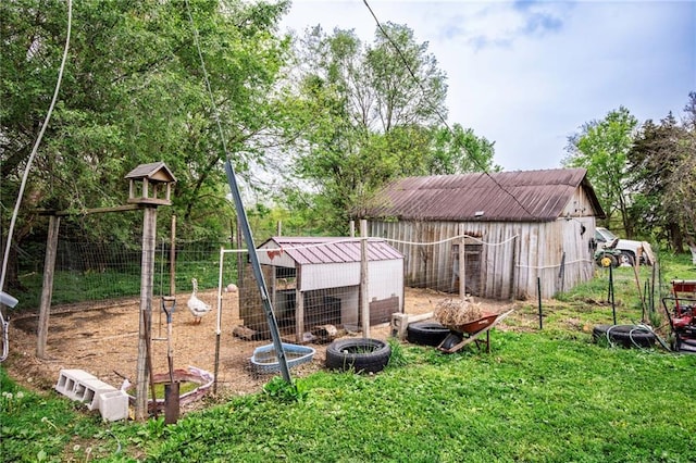 5971 Montgomery Rd, Mound City, KS 66056 - view of yard featuring an outdoor structure, exterior structure, and fence