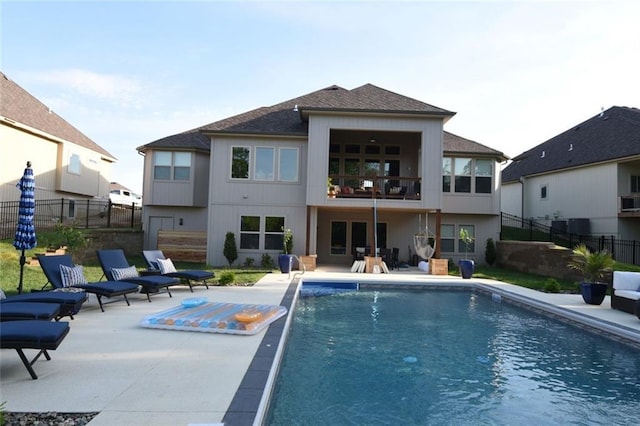 9410 Deer Run St, Lenexa, KS 66220 - back of house with a patio area, a balcony, and roof with shingles