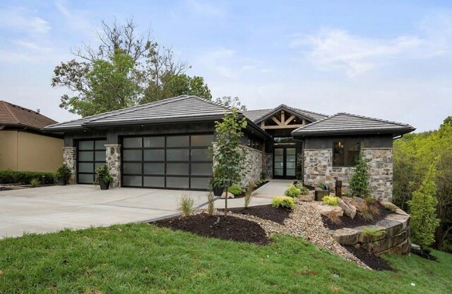 9410 Deer Run St, Lenexa, KS 66220 - view of front of house with an attached garage, driveway, stone siding, and a tiled roof