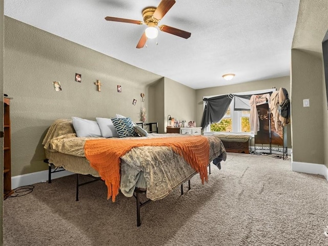 bedroom featuring carpet floors, baseboards, access to exterior, ceiling fan, and a textured ceiling