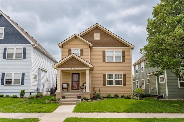 925 SW Ovation Dr, Lees Summit, MO 64081 - traditional-style house featuring a front lawn and covered porch