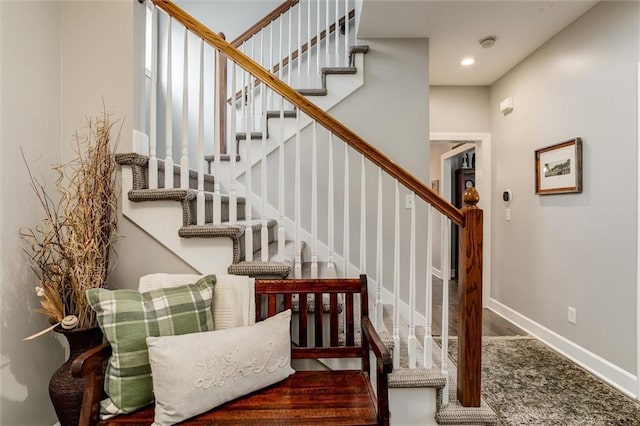 925 SW Ovation Dr, Lees Summit, MO 64081 - stairway with baseboards and wood finished floors