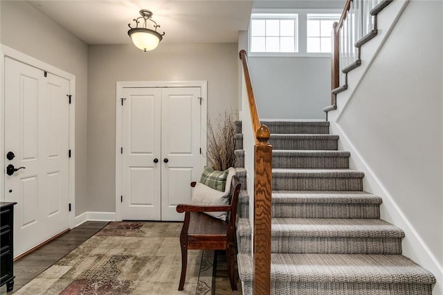 925 SW Ovation Dr, Lees Summit, MO 64081 - entrance foyer with stairs, baseboards, and wood finished floors