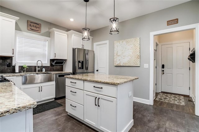 925 SW Ovation Dr, Lees Summit, MO 64081 - kitchen with white cabinetry, appliances with stainless steel finishes, a sink, and tasteful backsplash