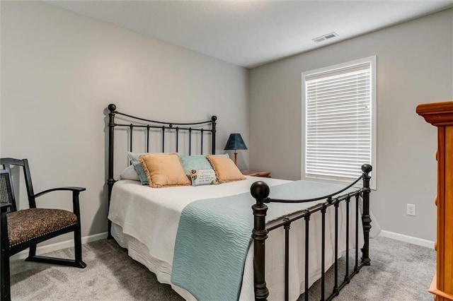 925 SW Ovation Dr, Lees Summit, MO 64081 - bedroom with light colored carpet, baseboards, and visible vents