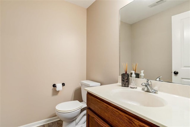 925 SW Ovation Dr, Lees Summit, MO 64081 - half bathroom featuring vanity, baseboards, toilet, and visible vents
