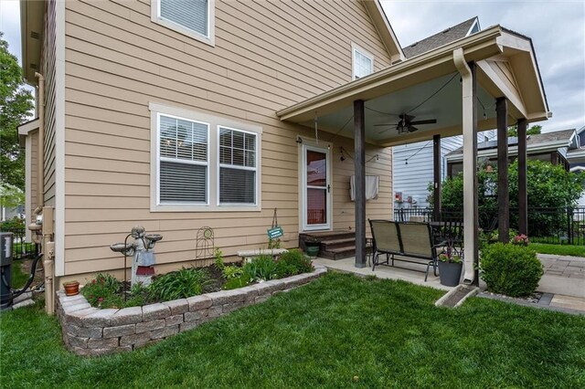 925 SW Ovation Dr, Lees Summit, MO 64081 - exterior space featuring a lawn, fence, a ceiling fan, and a patio area