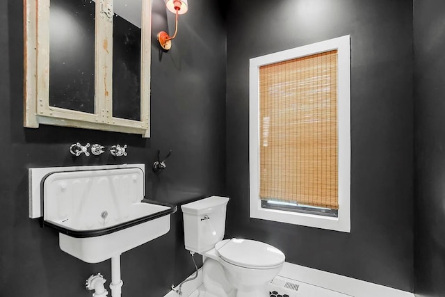 bathroom featuring toilet and visible vents
