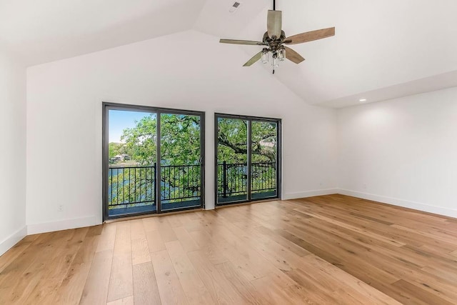 unfurnished room with baseboards, ceiling fan, a wealth of natural light, and light wood-style floors