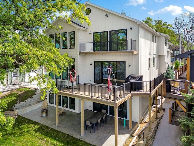 rear view of property featuring a patio area