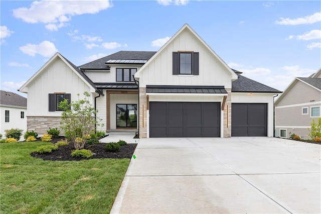 10675 W 142nd Ter, Overland Park, KS 66221 - modern farmhouse style home with board and batten siding, a standing seam roof, a front lawn, and driveway
