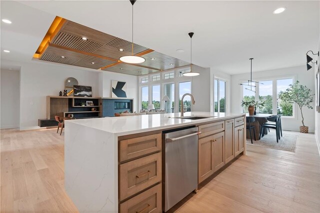 10675 W 142nd Ter, Overland Park, KS 66221 - kitchen featuring stainless steel dishwasher, light wood-type flooring, decorative light fixtures, an island with sink, and recessed lighting