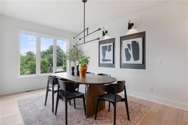 10675 W 142nd Ter, Overland Park, KS 66221 - dining space with healthy amount of natural light and light wood-style flooring
