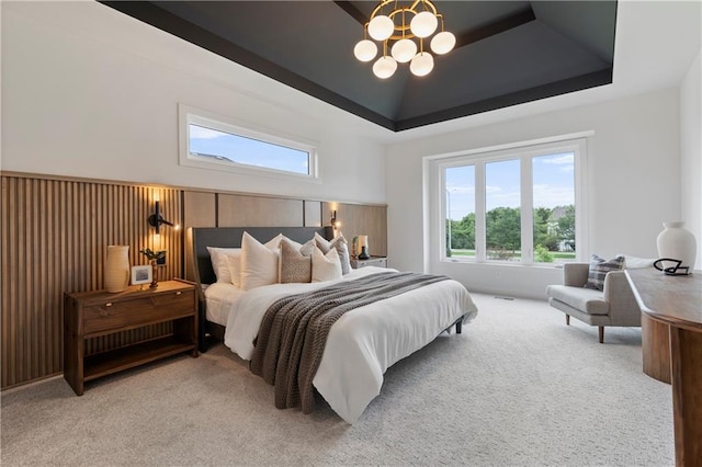 10675 W 142nd Ter, Overland Park, KS 66221 - bedroom with light colored carpet, a tray ceiling, and a chandelier