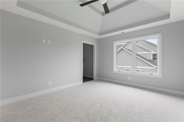 10675 W 142nd Ter, Overland Park, KS 66221 - empty room featuring a raised ceiling, carpet floors, and ceiling fan