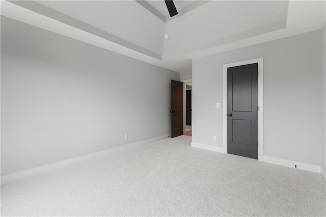 10675 W 142nd Ter, Overland Park, KS 66221 - carpeted spare room with a raised ceiling and a ceiling fan