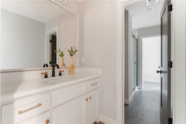 10675 W 142nd Ter, Overland Park, KS 66221 - bathroom featuring vanity, a stall shower, and tile patterned floors