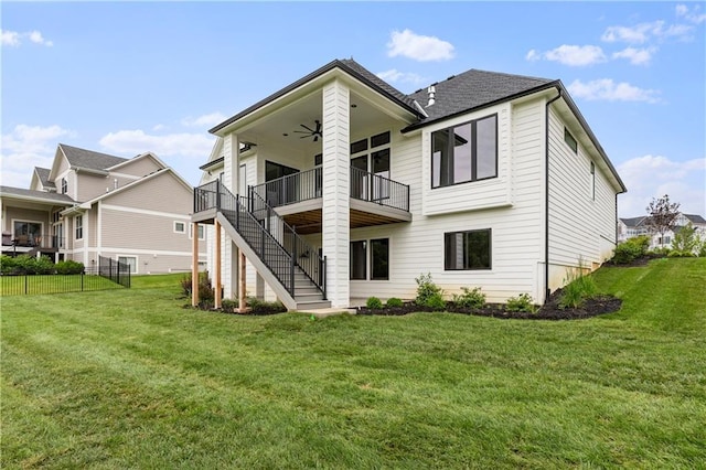 10675 W 142nd Ter, Overland Park, KS 66221 - back of property with a ceiling fan, stairway, and a deck