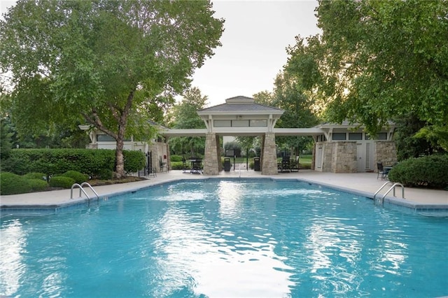 10675 W 142nd Ter, Overland Park, KS 66221 - outdoor pool with a gazebo and a patio