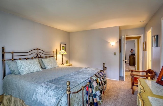 bedroom featuring baseboards and carpet flooring