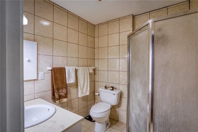 bathroom with tile walls, tile patterned floors, a shower stall, and toilet